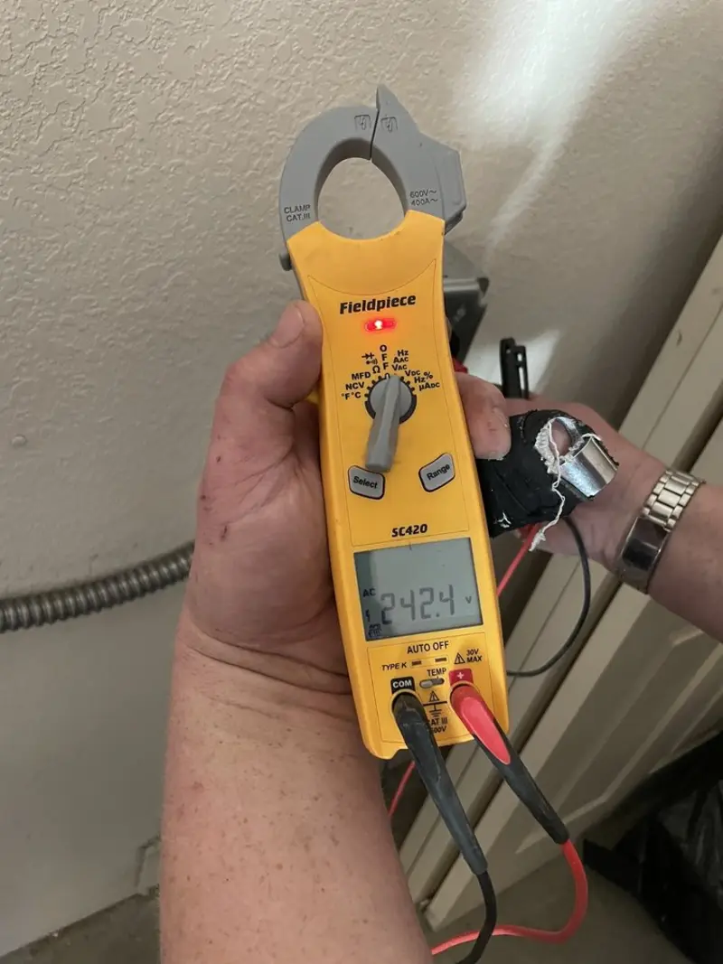 Voltage testing with clamp meter during Outlet Installation in Mount Vernon